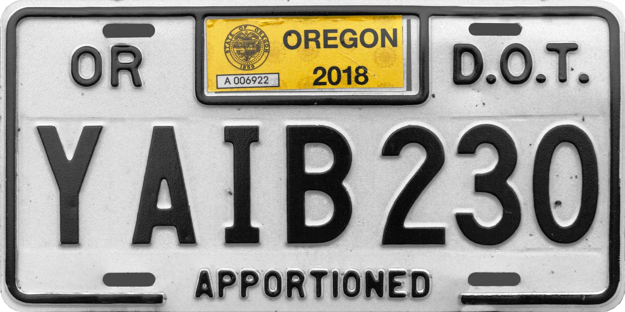 Oregon license plate with Apportioned along the bottom, D.O.T. in the upper right, and DEC and 2019 stickers