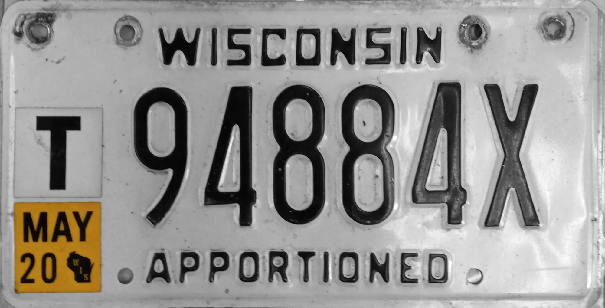 Wisconsin license plate with Apportioned along the bottom and the number 94884X in the center