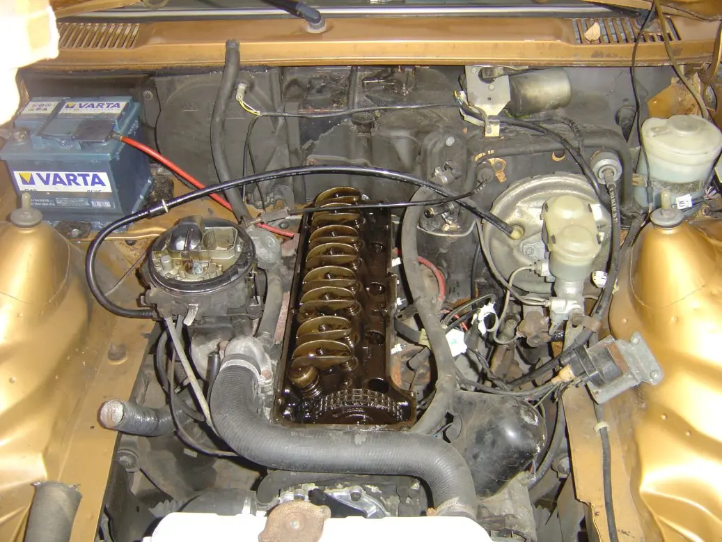 Engine with its cover removed, showing the rocker arms in the cylinder head