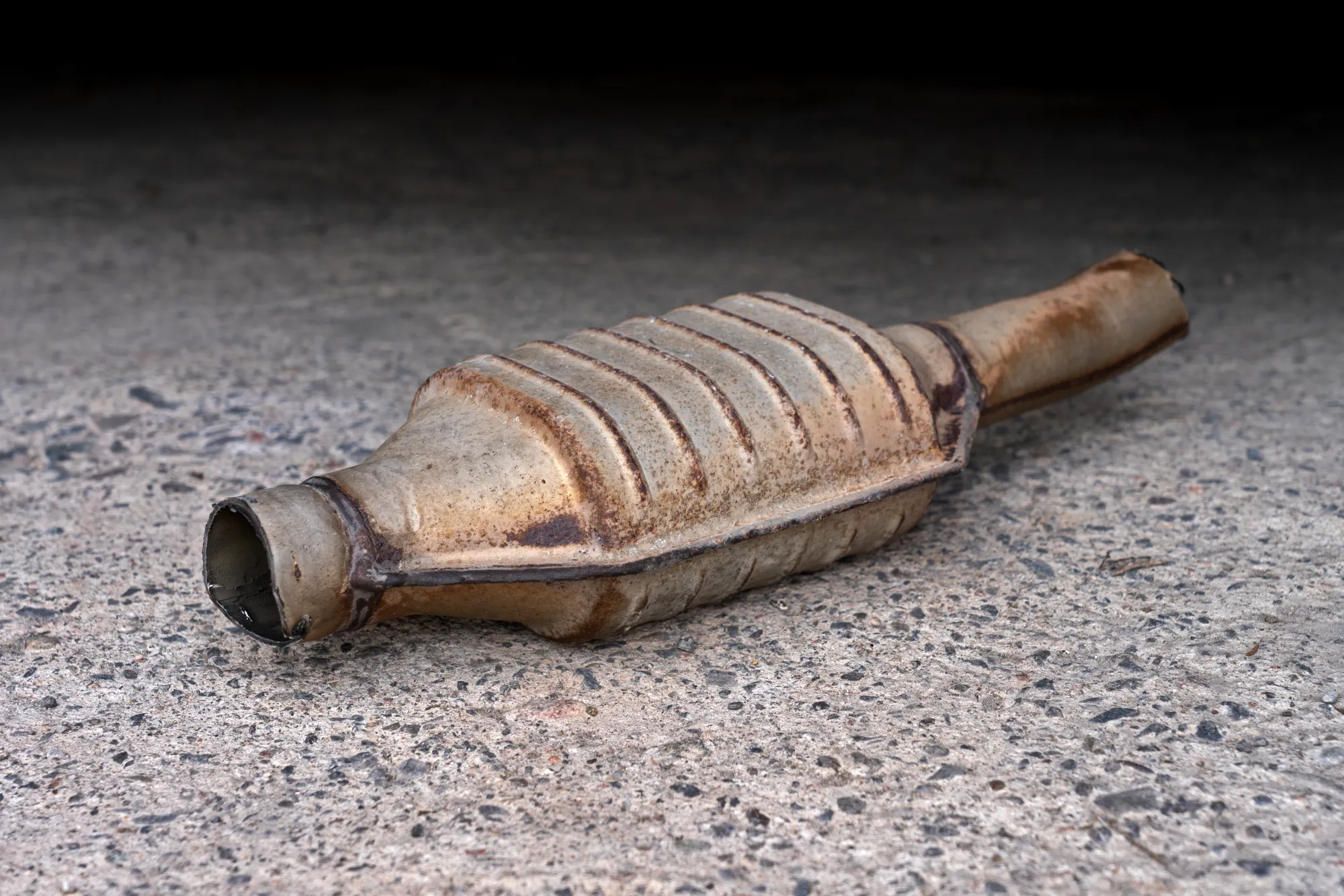 Removed catalytic-converter housing with inlet and outlet pipes