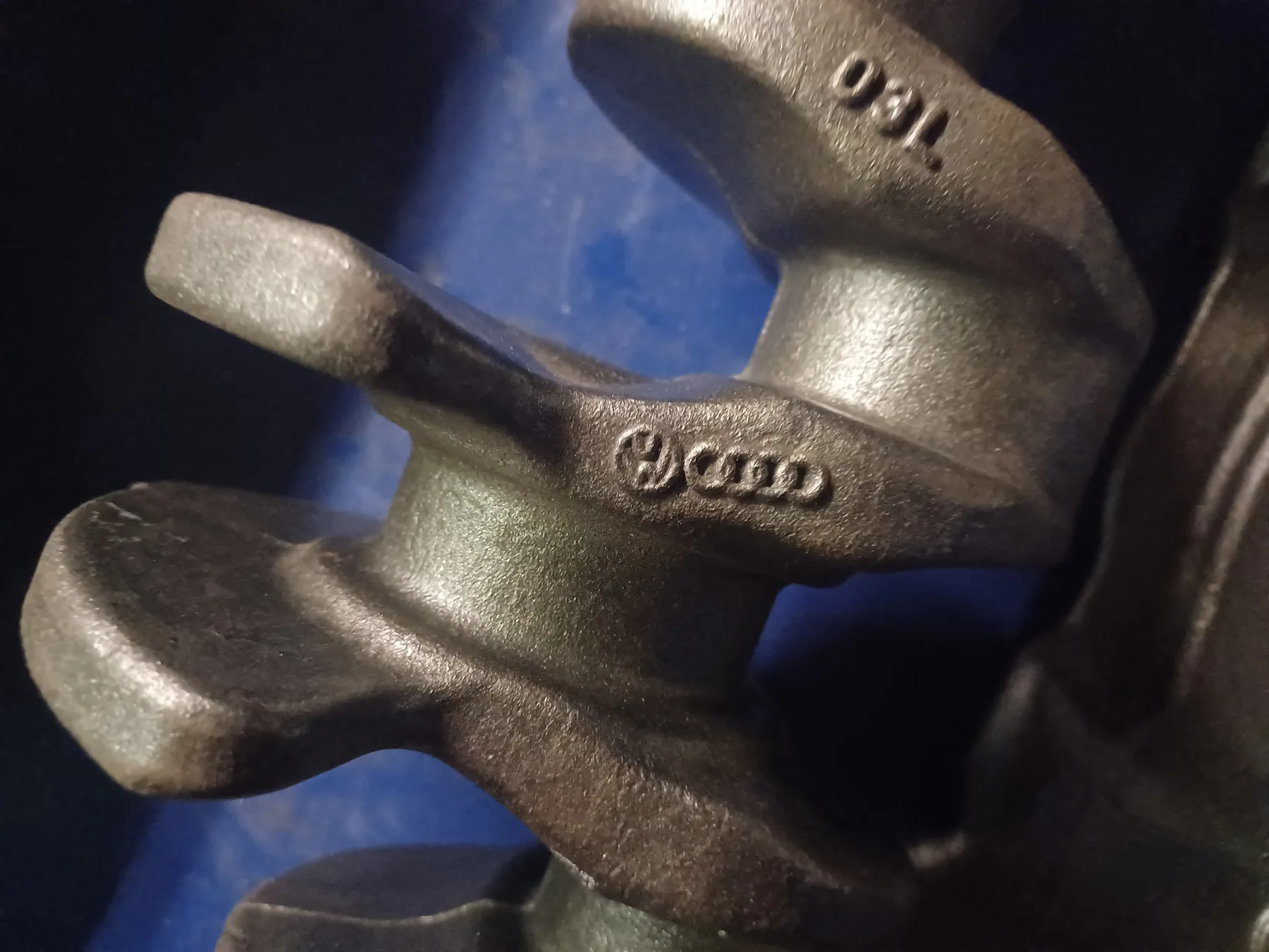 Close view of a crankshaft web and adjacent journal surfaces