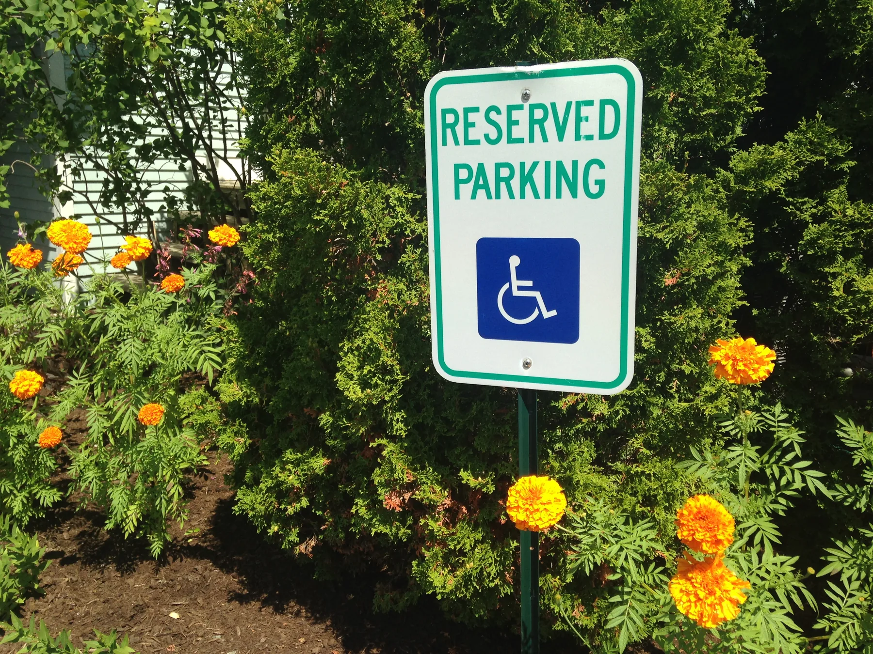 Reserved parking sign with a wheelchair symbol