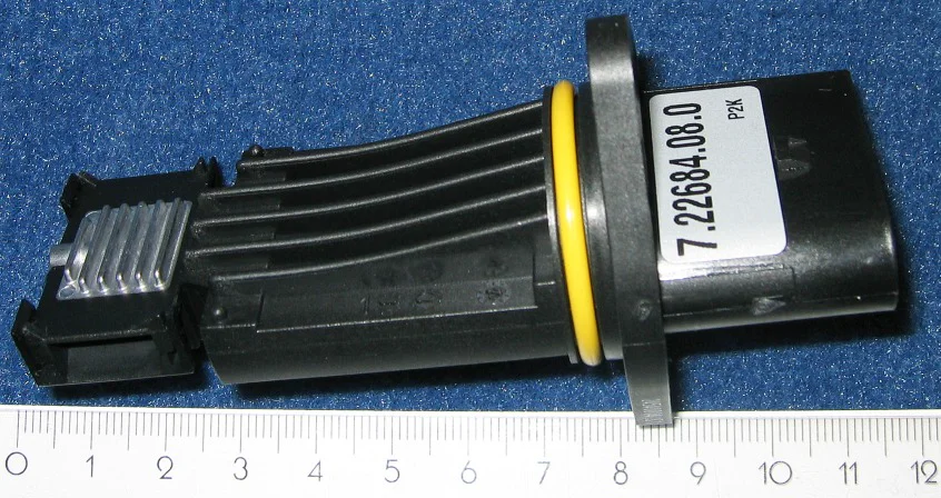 Plug-in mass-airflow sensing insert with O-ring and a part-number label