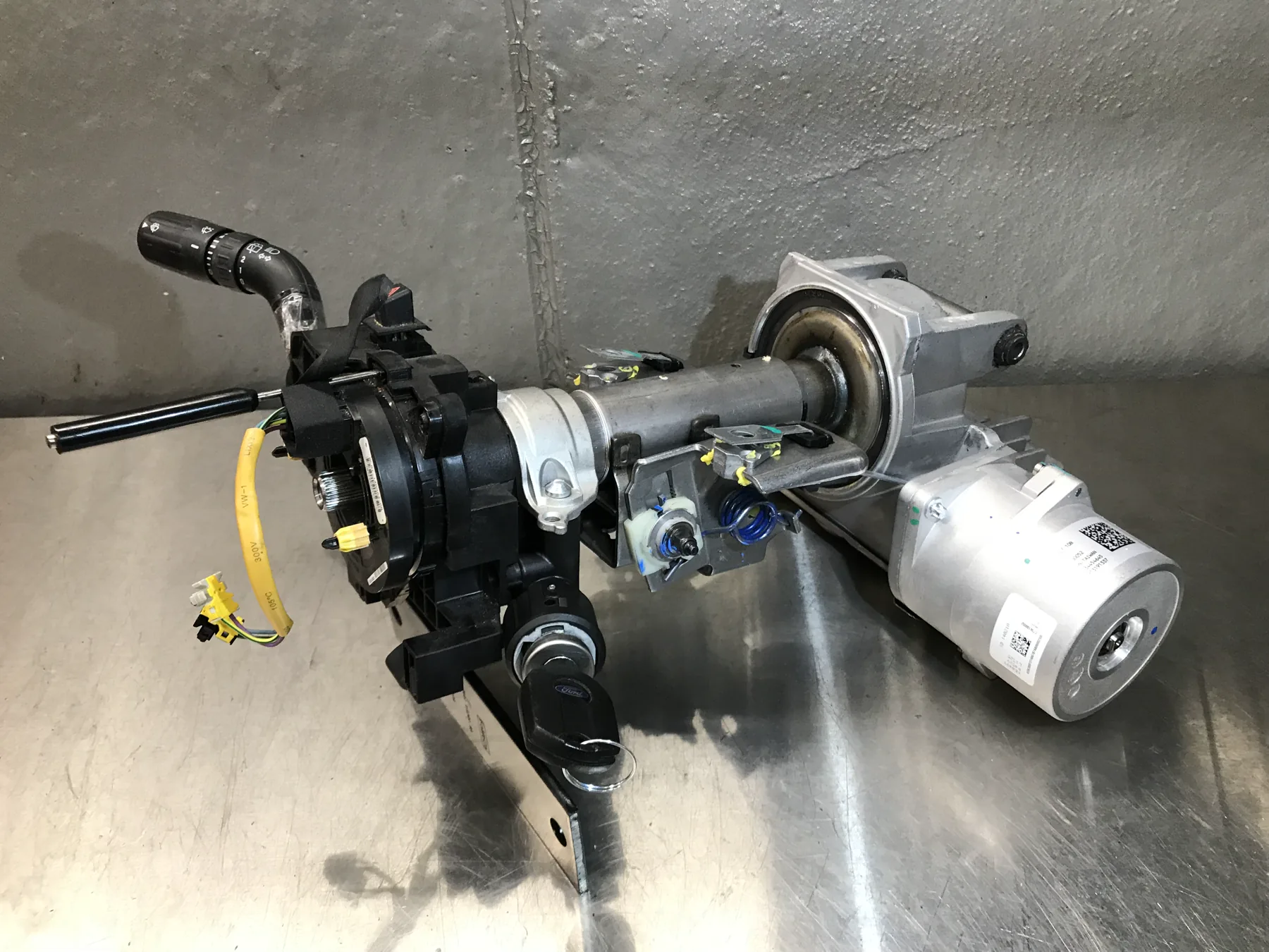 Removed electric power-steering column assembly with an electric motor attached