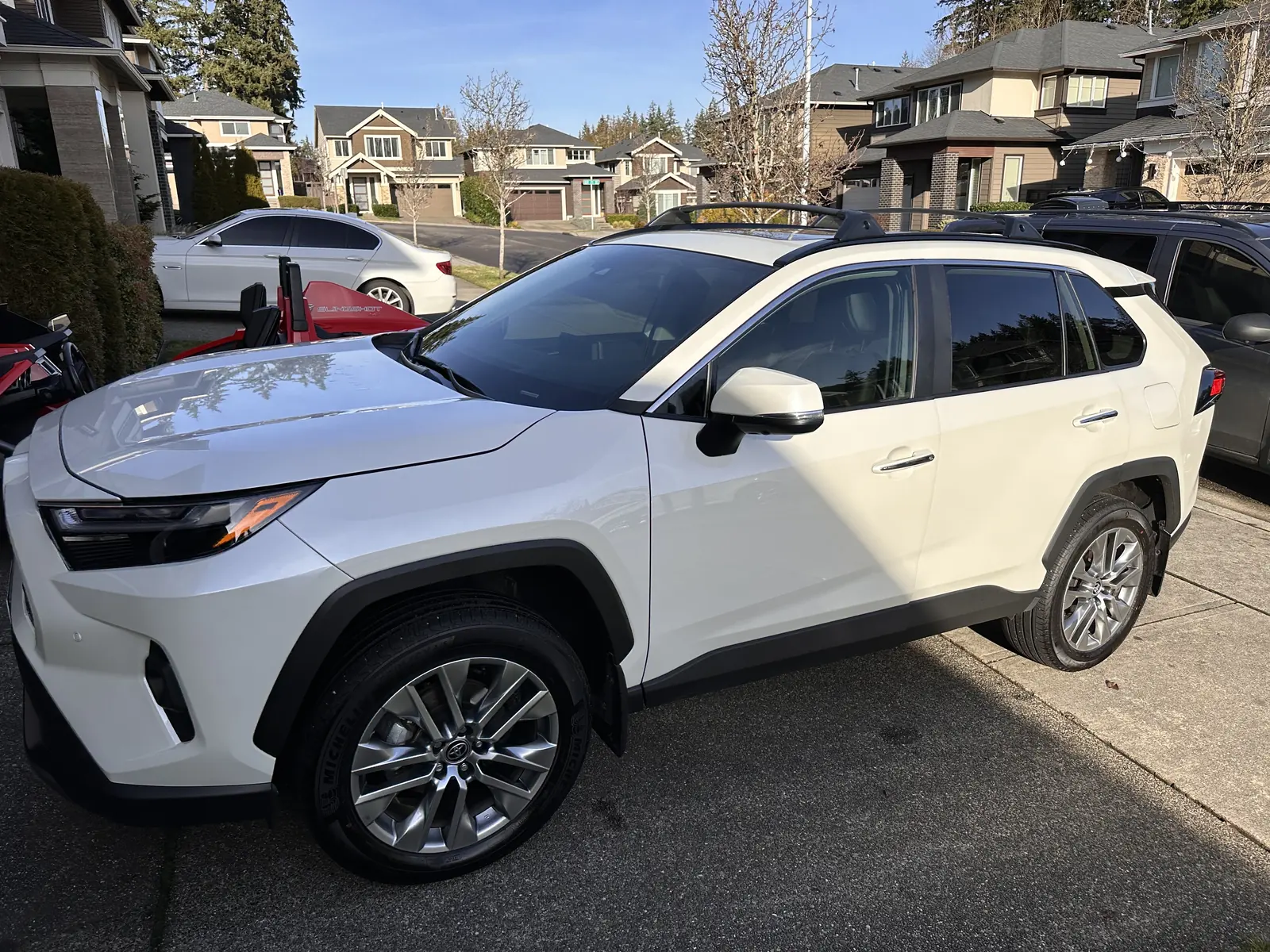 White SUV with dark film on the side windows