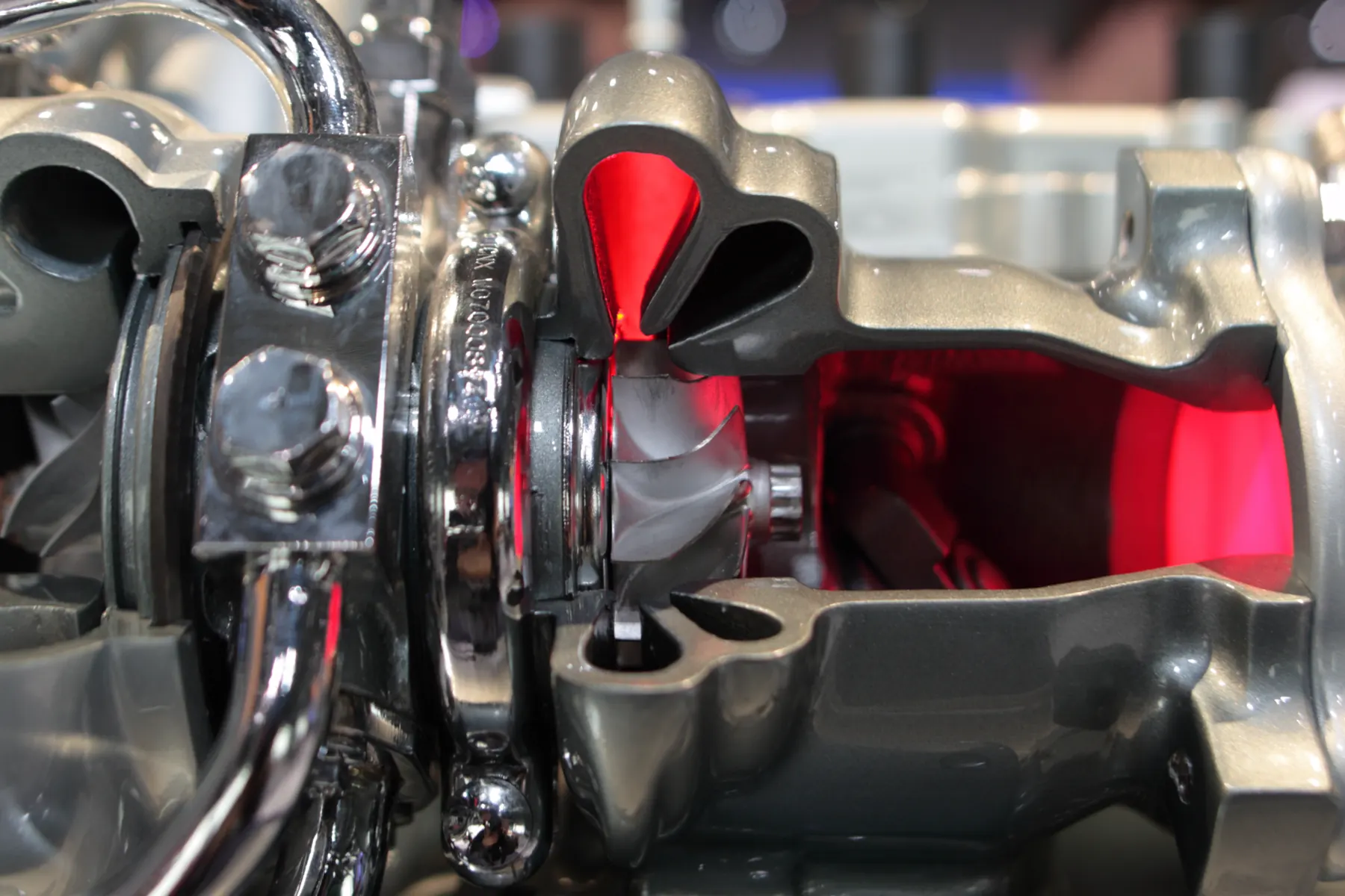 Mitsubishi twin-scroll turbocharger cutaway showing the turbine housing and internal bypass valve